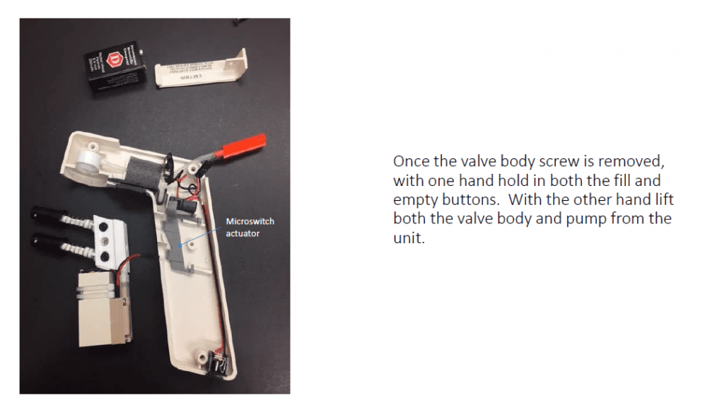 Once the valve body screw is removed, with one hand, hold in both the fill and empty buttons. With the other hand. lift both the valve body and pump from the unit.